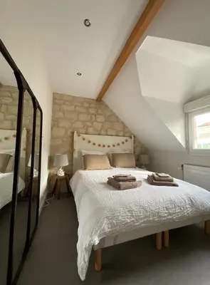 Un ou plusieurs lits dans un hébergement de l'établissement Chambres d'hôtes à 30 min de Paris