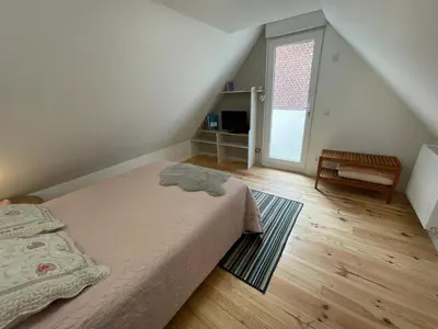 Un ou plusieurs lits dans un hébergement de l'établissement Maison moderne à Ancourt avec parking privé
