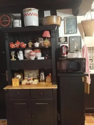Cuisine ou kitchenette dans l'établissement Les Petites Suites Dieppoises - La Tanière du Loup