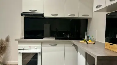 Cuisine ou kitchenette dans l'établissement Appartement calme et cosy - Proche centre