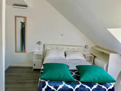 Un ou plusieurs lits dans un hébergement de l'établissement Appartement en duplex proche gare d'Amiens