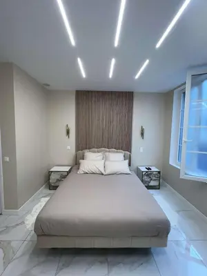 Un ou plusieurs lits dans un hébergement de l'établissement Suite Luxury Rouen