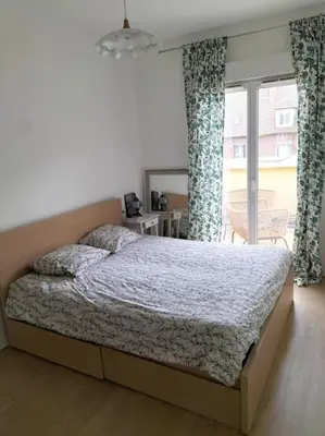 Un ou plusieurs lits dans un hébergement de l'établissement Cosy flat in Beauvais city center