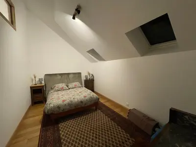 Un ou plusieurs lits dans un hébergement de l'établissement Maison chaleureuse- cheminée, nature et sport !