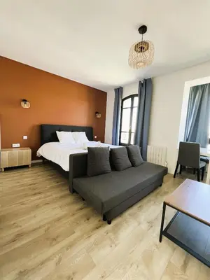 Un ou plusieurs lits dans un hébergement de l'établissement villa Konny studio 1er étage