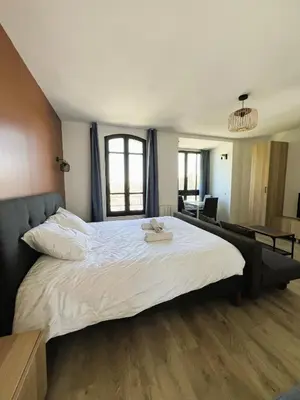 Un ou plusieurs lits dans un hébergement de l'établissement villa Konny studio rez-de-chaussée