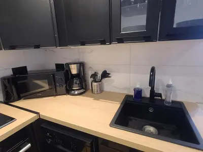 Cuisine ou kitchenette dans l'établissement Le Rivage Ébène & Distinction