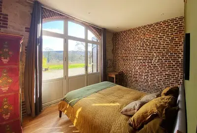 Un ou plusieurs lits dans un hébergement de l'établissement Les Gîtes de Little Castle campagne à 1 h de Paris