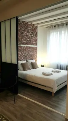 Un ou plusieurs lits dans un hébergement de l'établissement Le RUBIS - 2 Chambres - Centre ville