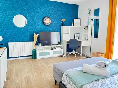 Un ou plusieurs lits dans un hébergement de l'établissement Spacieux studio - Au pied de la gare Cergy-le-Haut