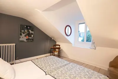Un ou plusieurs lits dans un hébergement de l'établissement La maison du 18