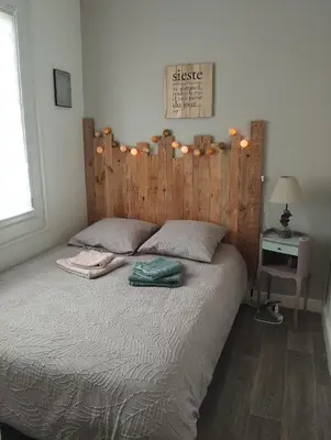 Un ou plusieurs lits dans un hébergement de l'établissement Appartement avec Vue sur Mer