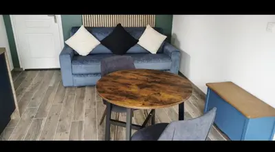 Coin salon dans l'établissement STUDIO VACANCES vue sur Mont Joli Bois