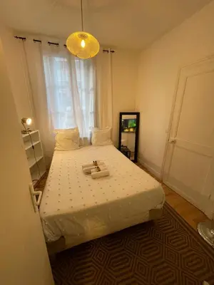 Un ou plusieurs lits dans un hébergement de l'établissement Charmant appartement centre ville