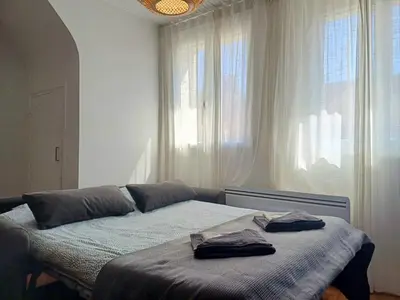 Un ou plusieurs lits dans un hébergement de l'établissement Le Loft - En Plein Centre Très Spacieux