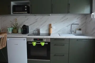 Cuisine ou kitchenette dans l'établissement Bel appartement neuf proche de Paris