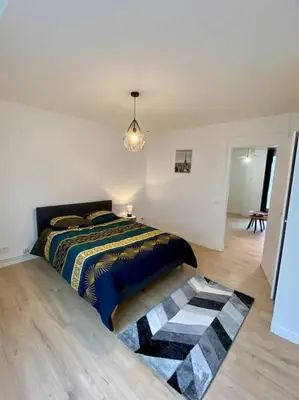 Un ou plusieurs lits dans un hébergement de l'établissement Appartement rénover avec terrasse