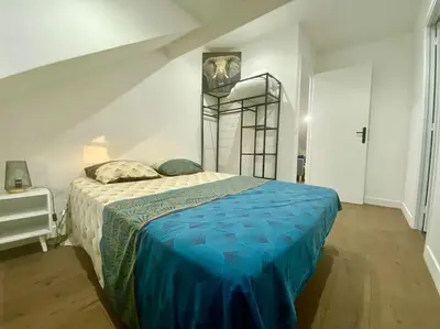 Un ou plusieurs lits dans un hébergement de l'établissement Appartement cosy