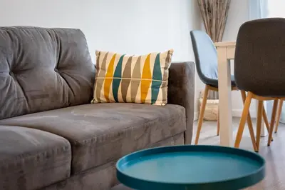 Coin salon dans l'établissement Appartement tout confort - Parking privé gratuit