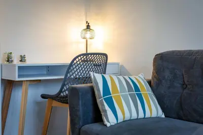 Coin salon dans l'établissement Appartement tout confort - Parking privé gratuit