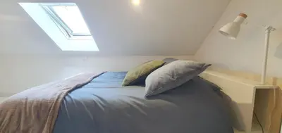 Un ou plusieurs lits dans un hébergement de l'établissement Maison Calme Terrasse et Jardin Vue Forêt