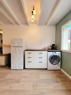 Cuisine ou kitchenette dans l'établissement La Vie en Rose