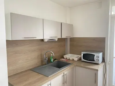 Cuisine ou kitchenette dans l'établissement Au dessus du jardin - 185