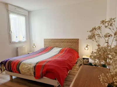 Un ou plusieurs lits dans un hébergement de l'établissement Votre cocon avec baignoire et Wifi à 15 min à pied du centre d'Amiens