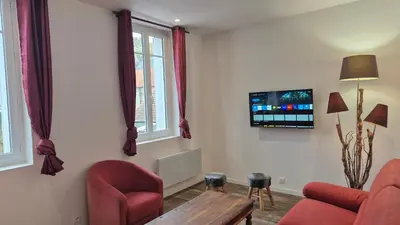 Télévision ou salle de divertissement dans l'établissement Maison Les Glycines Rouen