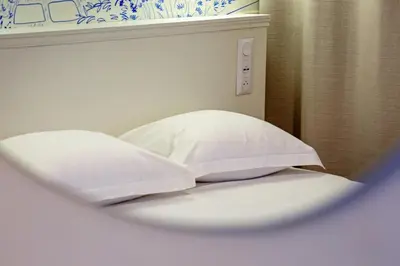 Un ou plusieurs lits dans un hébergement de l'établissement Petit Vicomte joli studio place du Vieux Marché