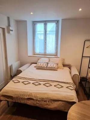 Un ou plusieurs lits dans un hébergement de l'établissement Studio cosy et fonctionnel