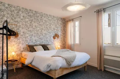 Un ou plusieurs lits dans un hébergement de l'établissement Charmante Maison à Rouen
