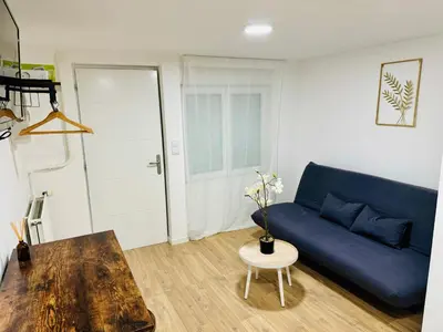 Coin salon dans l'établissement Rez-de-jardin équipé