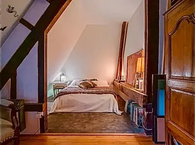Un ou plusieurs lits dans un hébergement de l'établissement Maison au bord de la Seine