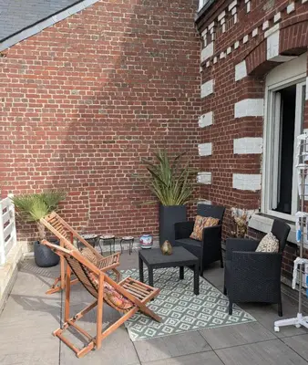 Coin salon dans l'établissement Spacieux apt avec terrasse proche plage