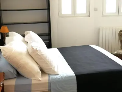 Un ou plusieurs lits dans un hébergement de l'établissement Appartement moderne à Elbeuf