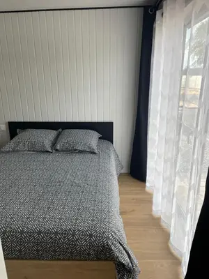 Un ou plusieurs lits dans un hébergement de l'établissement Le Chalet d'Amélia