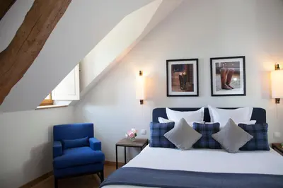Un ou plusieurs lits dans un hébergement de l'établissement Manoir de Surville Hotel & Spa & restaurant