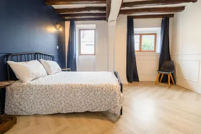 Un ou plusieurs lits dans un hébergement de l'établissement Maison avec spa proche Giverny