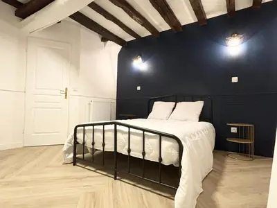 Un ou plusieurs lits dans un hébergement de l'établissement Maison avec spa proche Giverny