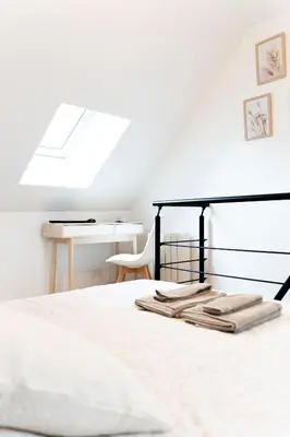 Un ou plusieurs lits dans un hébergement de l'établissement Maison Cosy Centre Gare Amiens