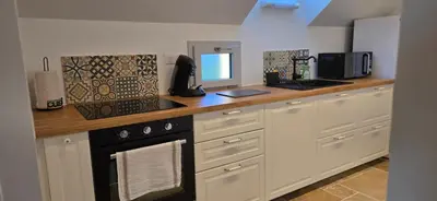 Cuisine ou kitchenette dans l'établissement Chez Mémère