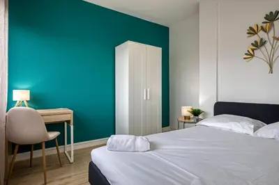 Un ou plusieurs lits dans un hébergement de l'établissement La Suite des 3 Tours spacieux 3 chambres