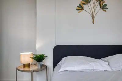 Un ou plusieurs lits dans un hébergement de l'établissement La Suite des 3 Tours spacieux 3 chambres