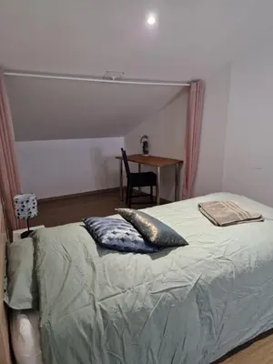 Un ou plusieurs lits dans un hébergement de l'établissement Maison de charme avec jardin au bord de l'Eure