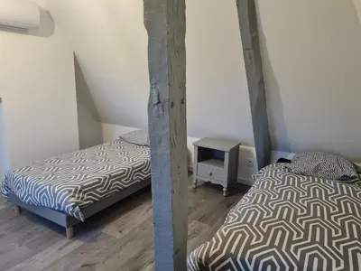 Un ou plusieurs lits dans un hébergement de l'établissement Gîte la Belle des Champs