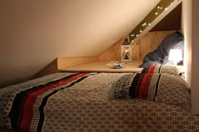 Un ou plusieurs lits dans un hébergement de l'établissement Studio cosy en centre-ville