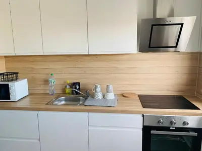 Cuisine ou kitchenette dans l'établissement Charmante appartement de 2 chambres à Saint-Étienne-du-Rouvray