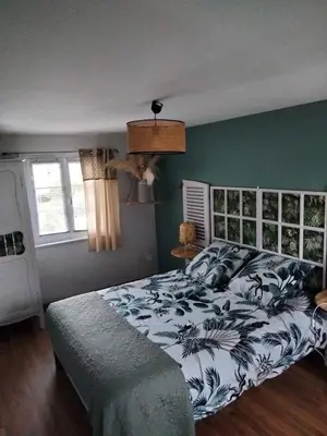 Un ou plusieurs lits dans un hébergement de l'établissement Maison accueillante à Petit-Caux avec jardin