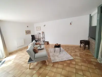 Coin salon dans l'établissement Le Nid Douillet - Gare 5 min , accès Paris facile